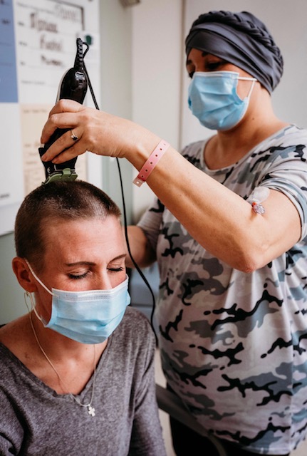 Sarah supporting Danyel through her journey, and shaving her head in solidarity. 