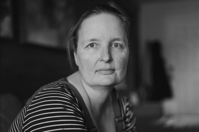 woman in black and white stripes gazing stoically