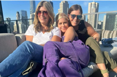 Mary Zack with sisters Emily and Betsy on a sunny urban balcony