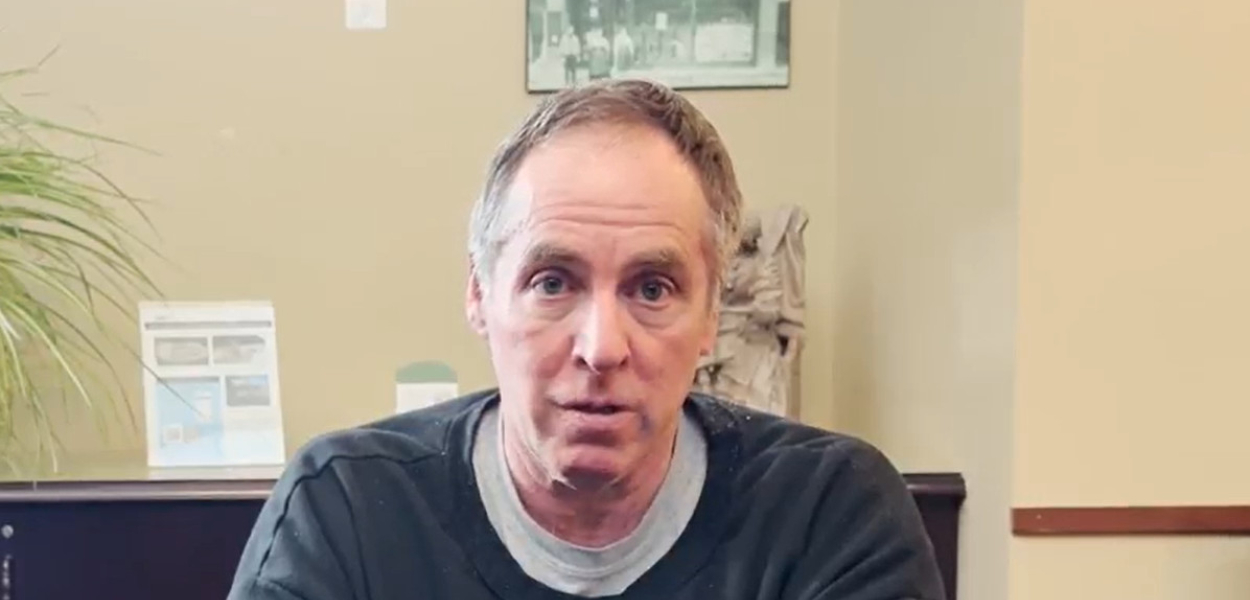 Chris sitting at desk