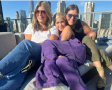 Mary Zack with sisters Emily and Betsy on a sunny urban balcony
