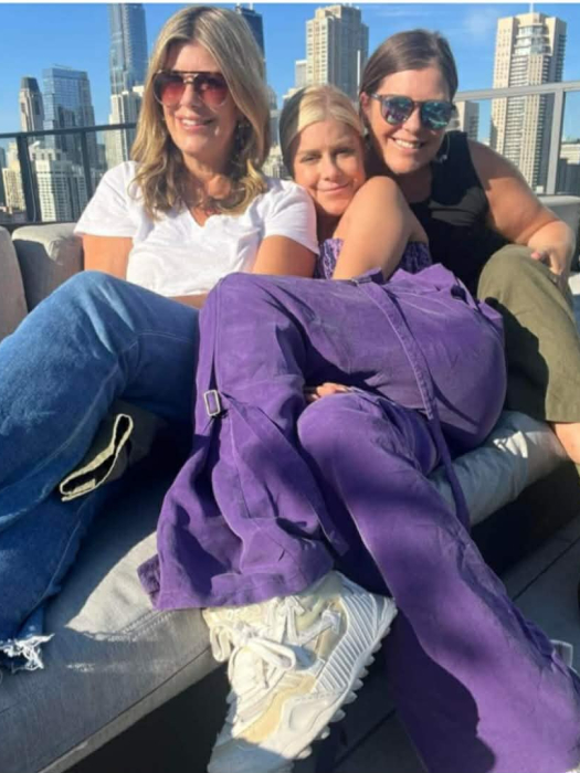 Mary Zack with sisters Emily and Betsy on a sunny urban balcony