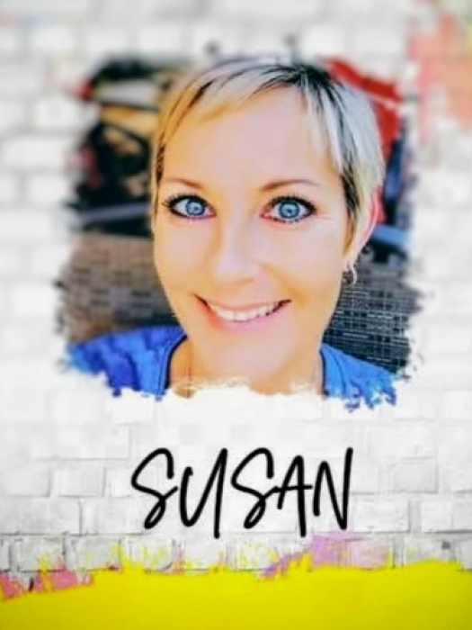 cutout of a smiling woman against a white brick background 