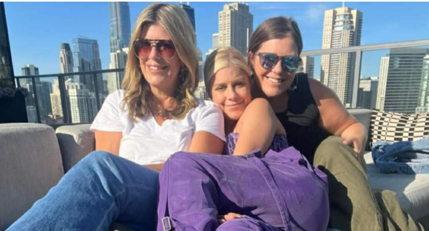 Mary Zack with sisters Emily and Betsy on a sunny urban balcony